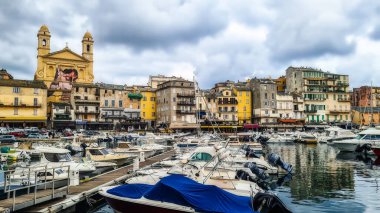 Corsica, France - 3 November 2022: Traditional fishing boats in Bastia port on sunny summer day, Corsica island, France clipart