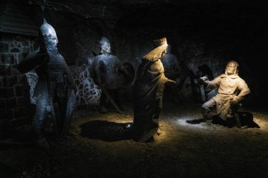 Salt statues of medieval warriors in a tunnel in the Wieliczka Salt Mine, Krakow, Poland