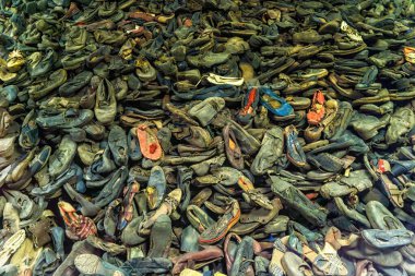 Oswiecim, Poland- 15 August 2022: Pile of shoes belonging to prisoners at Auschwitz WWII Nazi concentration camp, Poland