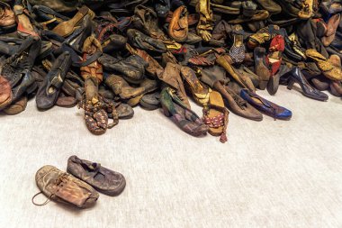 Oswiecim, Poland- 15 August 2022: Pile of shoes belonging to prisoners at Auschwitz WWII Nazi concentration camp, Poland