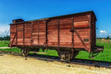 Oswiecim, Poland- 15 August 2022:A railroad car next to the ramp, it stands at the place where SS physicians carried out selection, sending the majority of the deported Jews to death in the gas chamber