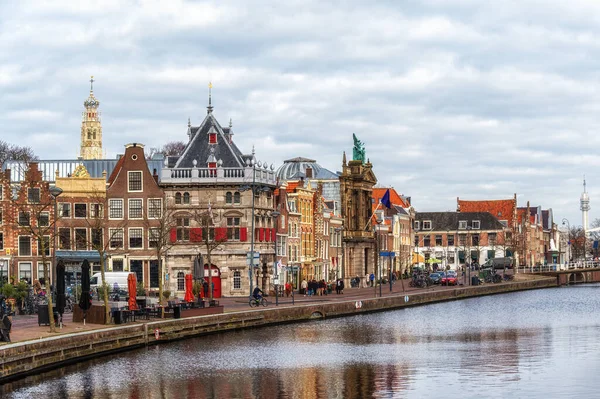 stock image Spaarne river with row of old houses and weigh house in the city of Haarlem, Holland, Netherlands