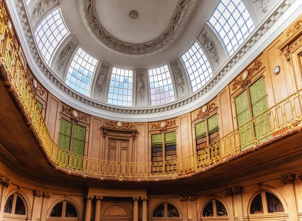 stock image Haarlem, The Netherlands - 11 February 2023: The Oval room (dated from 1784) inside Teylers Museum (art, natural history and science) with wooden and ornate architecture