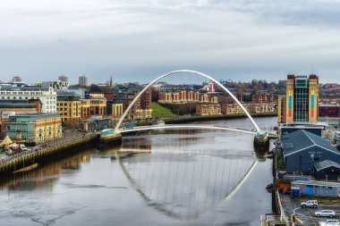 The Iconic Millennium Bridge crosses the River Tyne joining the Quaysides of Newcastle and Gateshead for cycles and pedestrians clipart