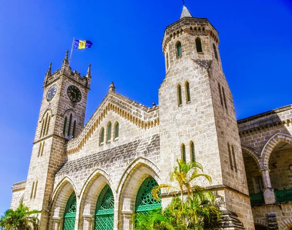 View of the old historical building in the form of a fortress with a tower and a clock on a bright Sunny day, the building Of the Parliament of Barbados, Little big Ben
