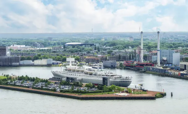 stock image Rotterdam, The Netherlands - June 04 2022: SS Rotterdam in the maashaven on the river nieuwe maas in Holland. cruise ship now used as restaurant and hotel in popular cosmopolitan city