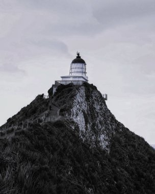 Nugget Point lighthouse in South Otago New Zealand clipart