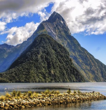 Mitre Peak in Fiordland National Park in the South Island of New Zealand. clipart