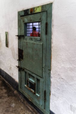 Seoul, South Korea - 07 September:The wooden door to a jail cell in one of the wings of the Seodaemun prison in Seoul, South Korea. clipart