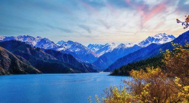 Heaven Lake of Tian Shan (Tianchi). A famous World Heritage site in Fukang, Changji, Xinjiang, China. clipart