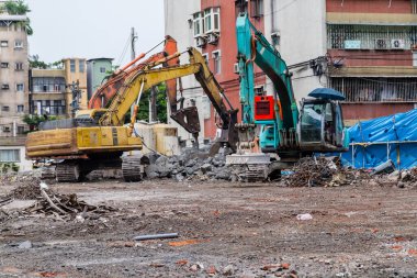Excavators moving debri on construction site