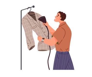 Adam askı kablosuz giysi buharlı tişört ütülüyor. Ev işi yapan bir koca, ev işleri, ev işleri, ev temizliği, günlük kıyafetlerin içinde duran demir elektrikli aletleri olan biri. Rutin ev işleri, çamaşır.