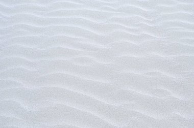 Beyaz kum arka plan, makro beyaz kumu kapat. Tatil için dinlenme yeri..