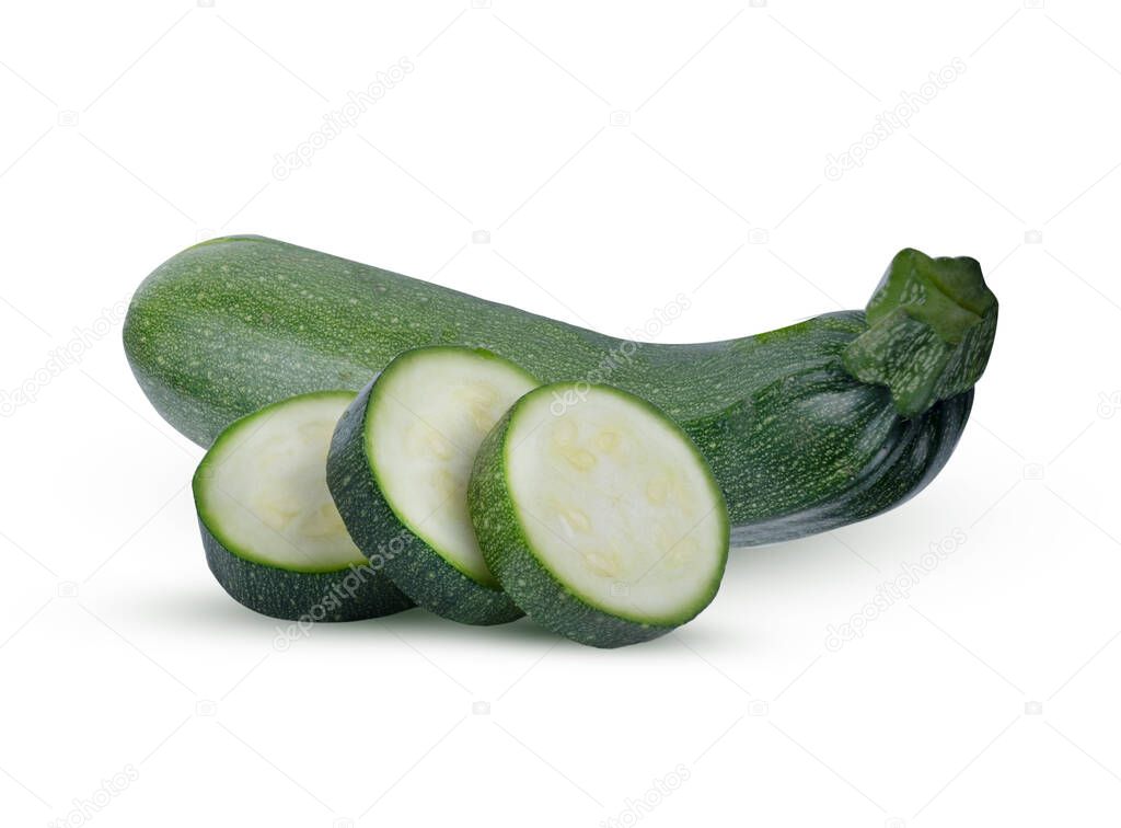 Fresh green zucchini sliced into circles on the  cutting  against the same whole  on  white background.