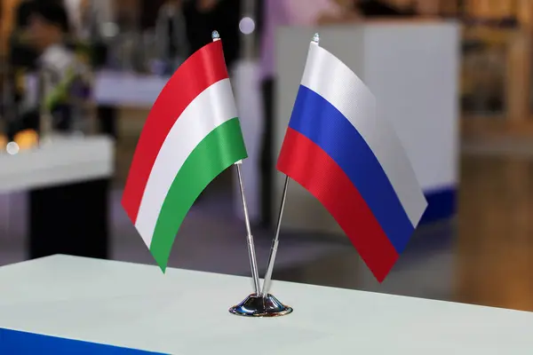 Small tabletop flags of Hungary and Russia together at some event or fair. Flags of two countries as a symbol of cooperation between states. Joint business of the Russian Federation and Hungary.