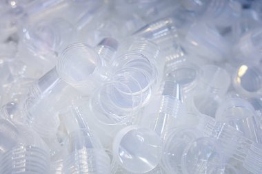 Mass production of food packaging. Lots of transparent plastic containers with lids. Food packaging made of polypropylene using thermoforming. clipart