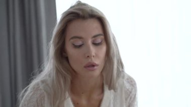 This stock video shows a beautiful girl in sexy erotic lingerie, slow motion