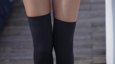 This stock video shows a beautiful girl in sexy erotic lingerie, slow motion