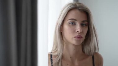 This stock video shows a beautiful girl in sexy erotic lingerie, slow motion