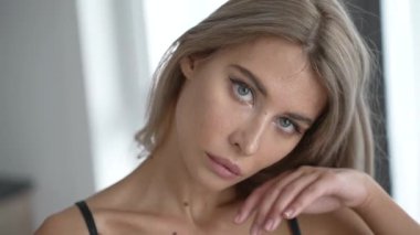 This stock video shows a beautiful girl in sexy erotic lingerie, slow motion