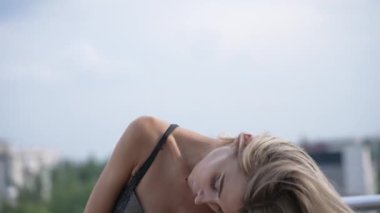 This stock video shows a beautiful girl in sexy erotic lingerie, slow motion