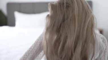 This stock video shows a beautiful girl in sexy erotic lingerie, slow motion