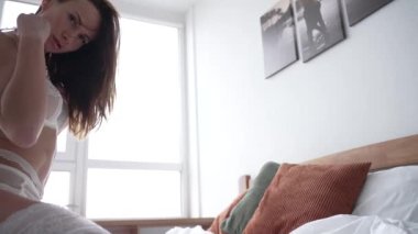 This stock video shows a beautiful woman in sexy lingerie