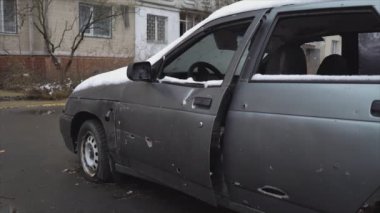 This stock video shows a shot down civilian car during the war in Ukraine in 8K resolution