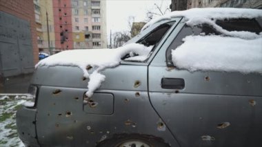 This stock video shows a shot down civilian car during the war in Ukraine in 8K resolution