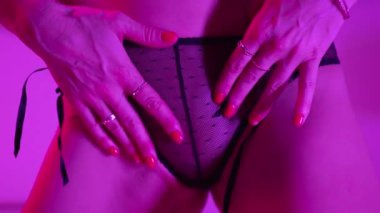This stock video shows a woman in erotic sexy lingerie