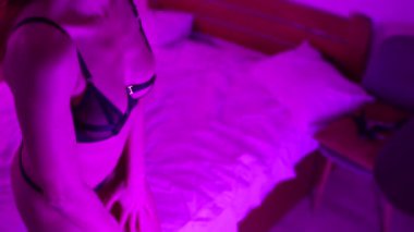 This stock video shows a woman in erotic sexy lingerie