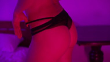 This stock video shows a woman in erotic sexy lingerie