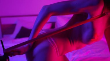 This stock video shows a woman in erotic sexy lingerie