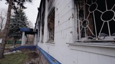 This stock video shows a police station destroyed during the war in Ukraine, slow motion