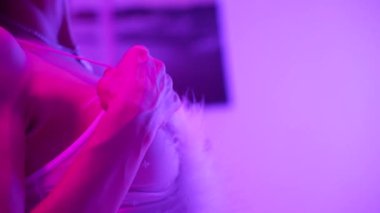 This stock video shows a woman in erotic sexy lingerie