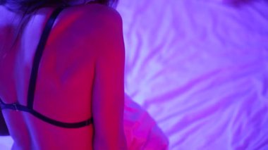 This stock video shows a woman in erotic sexy lingerie