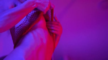 This stock video shows a woman in erotic sexy lingerie