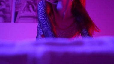 This stock video shows a woman in erotic sexy lingerie