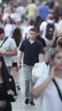 KYIV, UKRAINE  SEPTEMBER 1, 2024 : Vertical video of a crowd of people on a city street