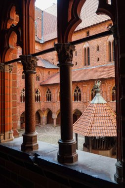 View of the main courtyard from the gallery window in the castle of the Knights Templar in Malbork. Poland.