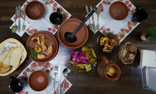 stock image Traditional Ukrainian food on the table in clay dishes.