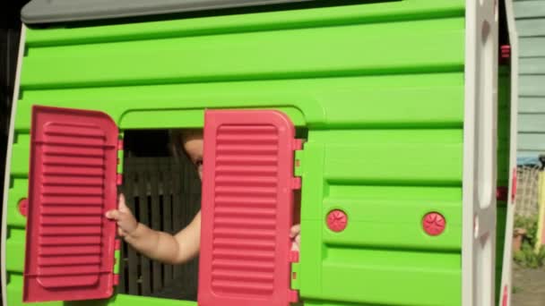 Slow Motion Cute Little Toddler Girl Kid Hiding Toy House — Stock Video
