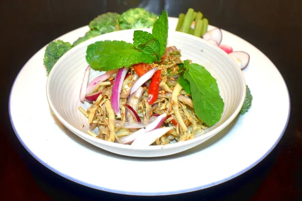 Spicy bamboo shoot salad Seasoning with mint leaves Red onion side dish with organic vegetables. North East Thai food (Yum Nor Mai) Local Thai food.