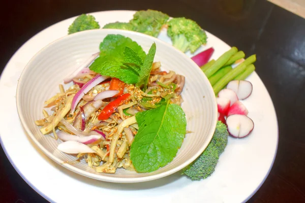 Spicy bamboo shoot salad Seasoning with mint leaves Red onion side dish with organic vegetables. North East Thai food (Yum Nor Mai) Local Thai food.