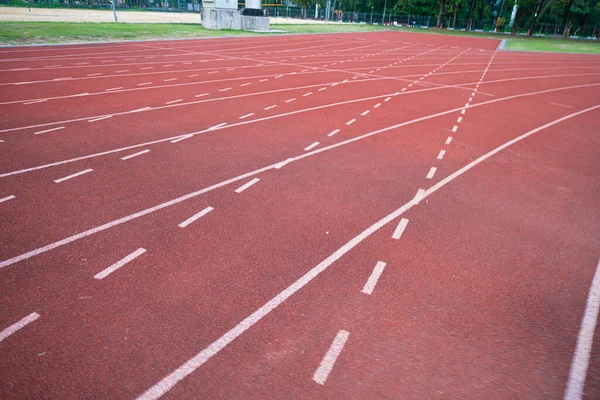 Empty fast running lane in outdoor sport stadium running track