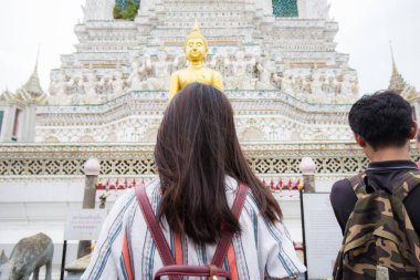 Asian woman travel in buddha temple backpacke tourist in Bangkok Thailand
