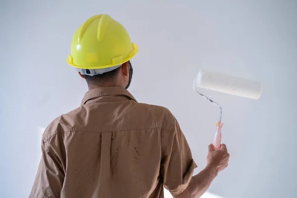 Men Paint Indoor Color Roller Paint White Background — стоковое фото