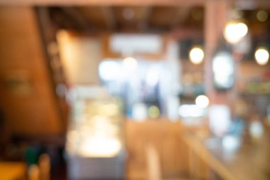 Blurred vintage coffee shop with bokeh aroma drink background tonned image