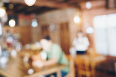 Blurred vintage coffee shop with bokeh aroma drink background tonned image