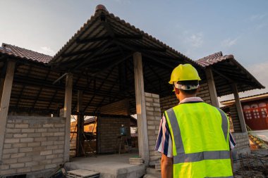 Engineer man working on construction site new house building inspector man